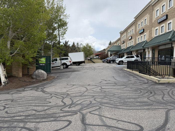 Driveway leading to the main parking lot with the entrance to the office, climate-controlled storage units, and commercial storage spaces