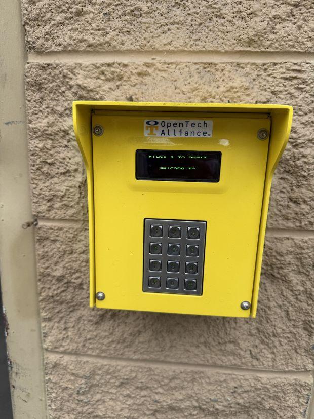 Keypad on the face of the building used to access indoor storage units