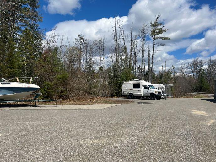 Outdoor vehicle storage in Arundel, ME, featuring boats and RVs