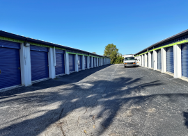A wide aisle with various outdoor drive-up storage units in Marco Island at E Elkcam Circle