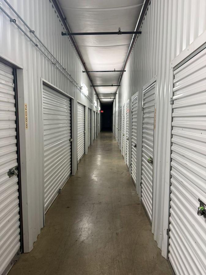 A hallway with various climate-controlled storage units in West Chicago at 28W725 Garys Mill Rd