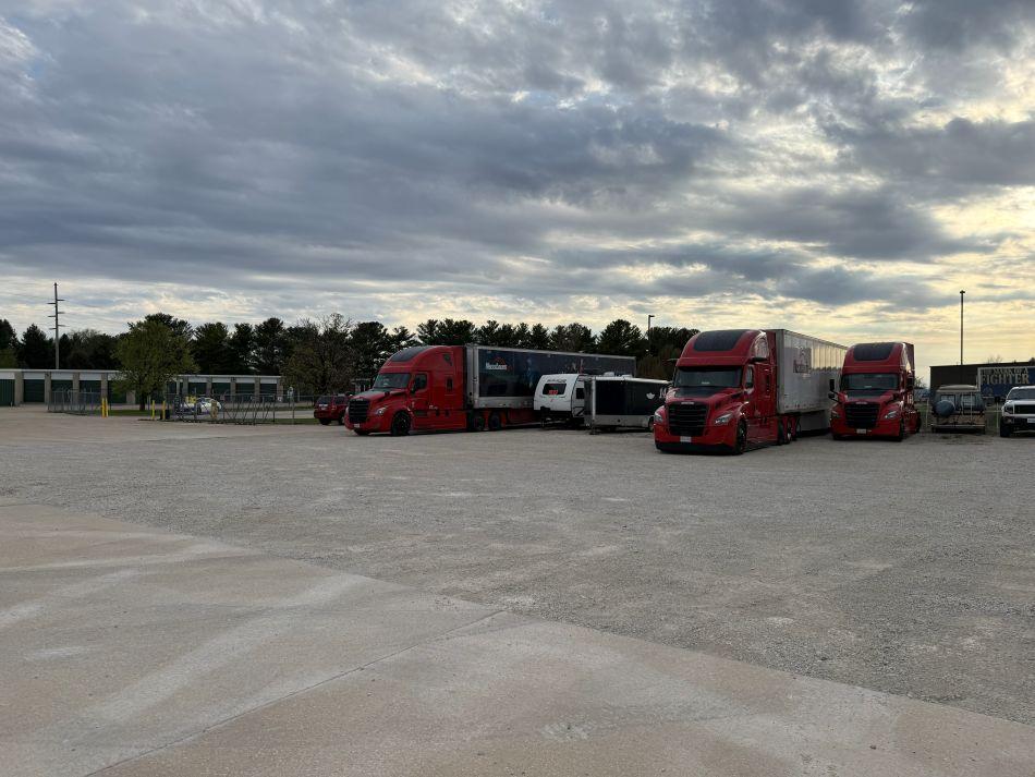 Outdoor vehicle storage in Champaign, IL on Lager Drm featuring trailers, cars, and large commercial vehicles